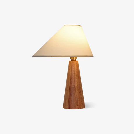 Table lamp with a wide shallow linen shade on a turned wood cone base