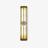 Tall exterior wall sconce, a slim lantern column with glowing panels and a round fretwork medallion