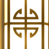 Close view of the round fretwork medallion across the glowing panel