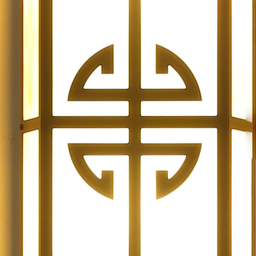 Close view of the round fretwork medallion across the glowing panel