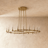 The brass ring seen at an angle, candle tubes standing up from the flat band