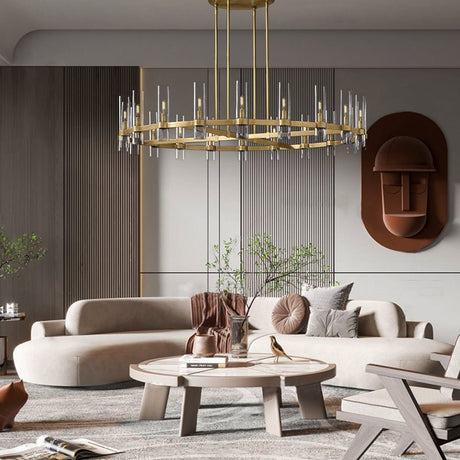 The brass ring lit above a curved sofa, a round wooden table and wall art