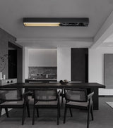 Bar mounted flat on a wall above a dining table with eight dark chairs