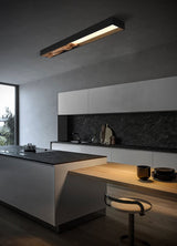 Bar mounted flat on a kitchen wall above an island with a stool and bowls