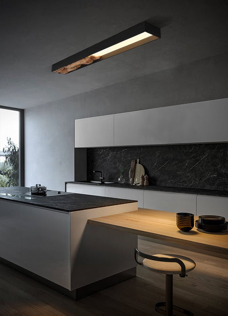 Bar mounted flat on a kitchen wall above an island with a stool and bowls