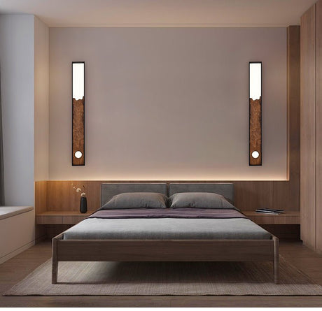 Two bars upright on either side of a bed with a low wood platform