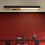 Bar mounted flat above a red wall and a low console holding two vessels