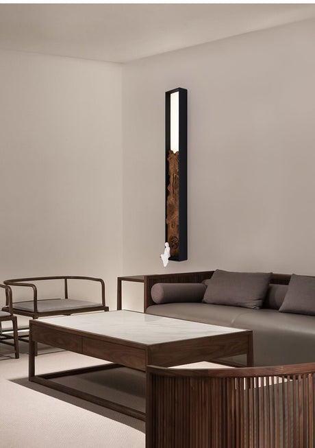 Bar upright on a pale wall beside a low wood table and floor seating