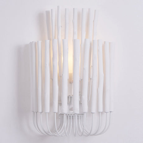 Close view of lit wood rods, the lamp visible deep inside the cluster