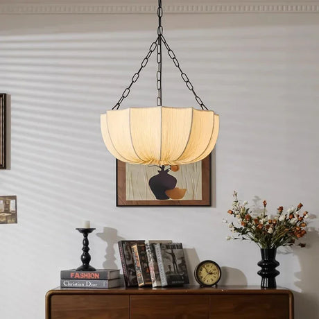 Gathered fabric shade unlit above the same console