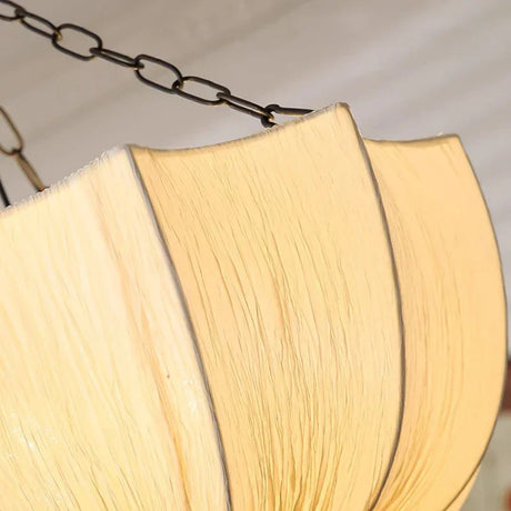 Close view of the lit shade showing the seams between panels