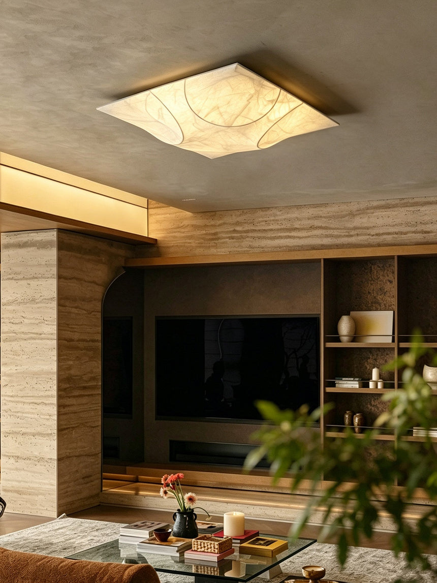 Square silk ceiling light above a living room with a media wall