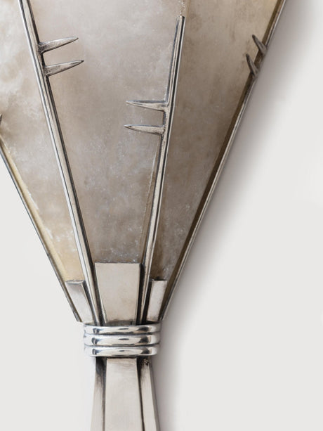 Close view of the metal frame holding the alabaster blades