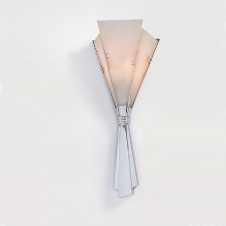 The fan sconce lit, the veining of the alabaster showing through