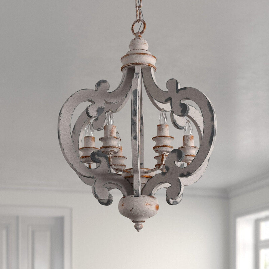 Two scroll arms and the distressed antique white finish on them