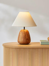 Farmhouse table lamp on a sideboard beside a patterned ceramic tile