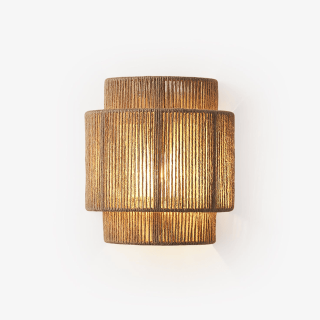 Wall lamp with a two tier shade of handwoven hemp rope, lit warm from inside