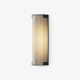 Flat outdoor wall light in black with a ribbed translucent lit face