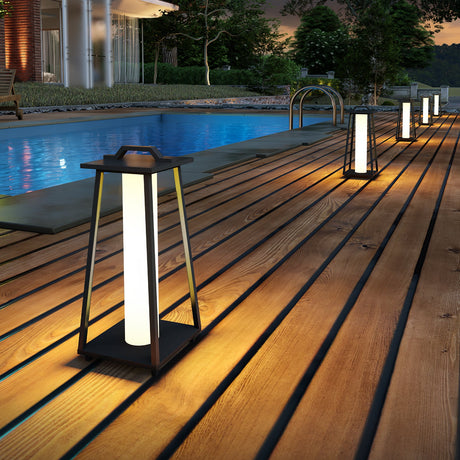 A run lit along poolside decking beside a dark swimming pool