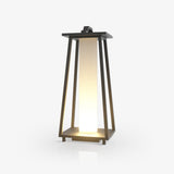 Tapered open frame lantern in dark metal with a lit inner panel