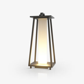 Tapered open frame lantern in dark metal with a lit inner panel