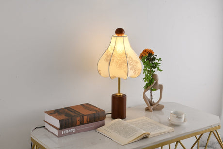 Close view of the lit parasol shade above the brass stem and base