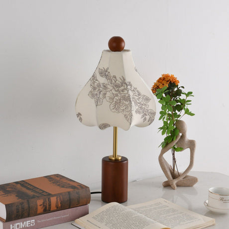 Taller bell shaped printed shade unlit on the same walnut base