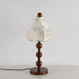 Walnut floral table lamp unlit, the printed pattern visible on the petals