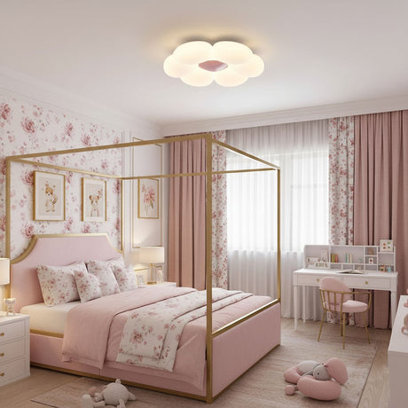 Flower ceiling light above a pink canopy bed in a child bedroom