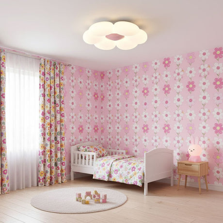 Flower ceiling light with a pink center in a room with floral wallpaper