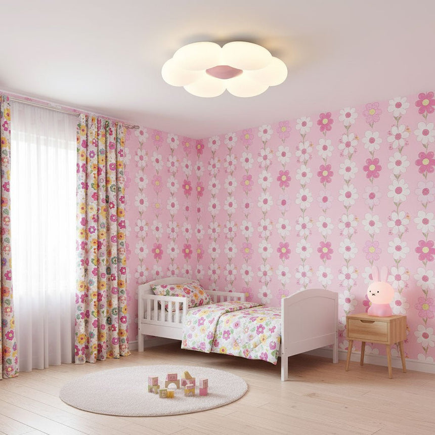 Flower ceiling light with a pink center in a room with floral wallpaper