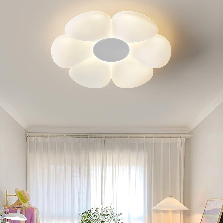 Flower ceiling light with a gray center above a window seat