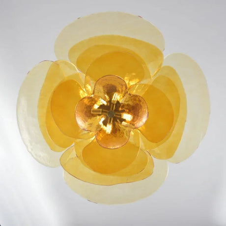 The amber petal shade seen straight from below with the lamps lit inside