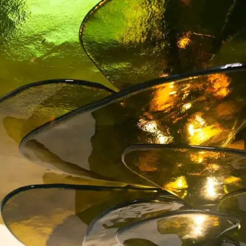 Close view of the tinted glass petals overlapping at their edges