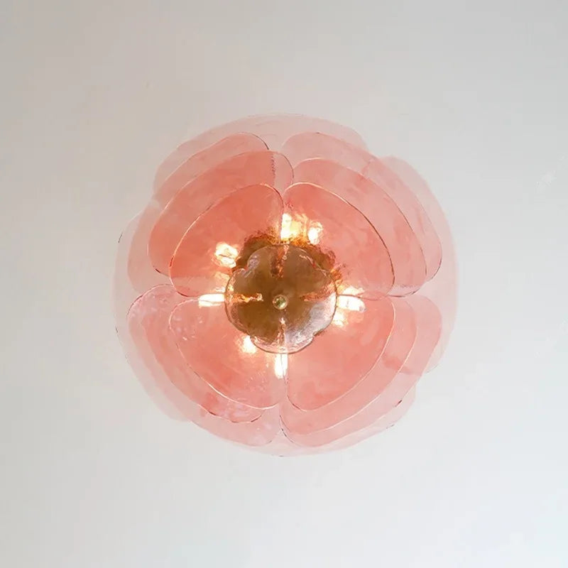 The pink petal shade seen straight from below with the lamps lit inside