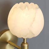 Close view of the lit flower shade showing the veining in the stone