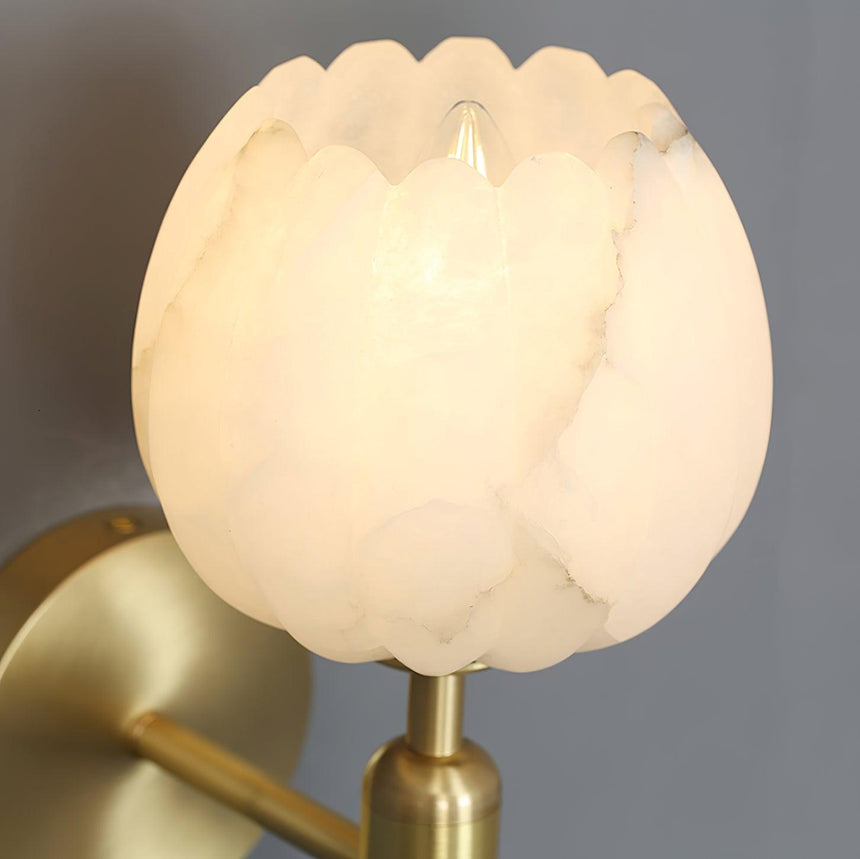 Close view of the lit flower shade showing the veining in the stone