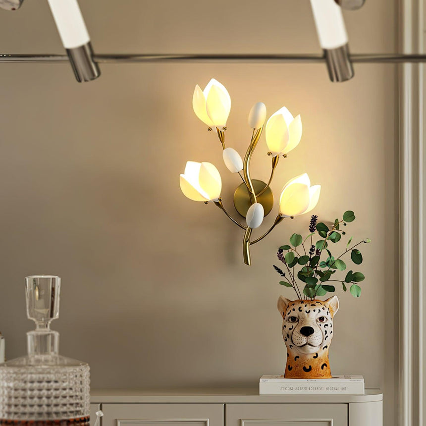 The light glowing above a white cabinet with a decanter and a leopard vase