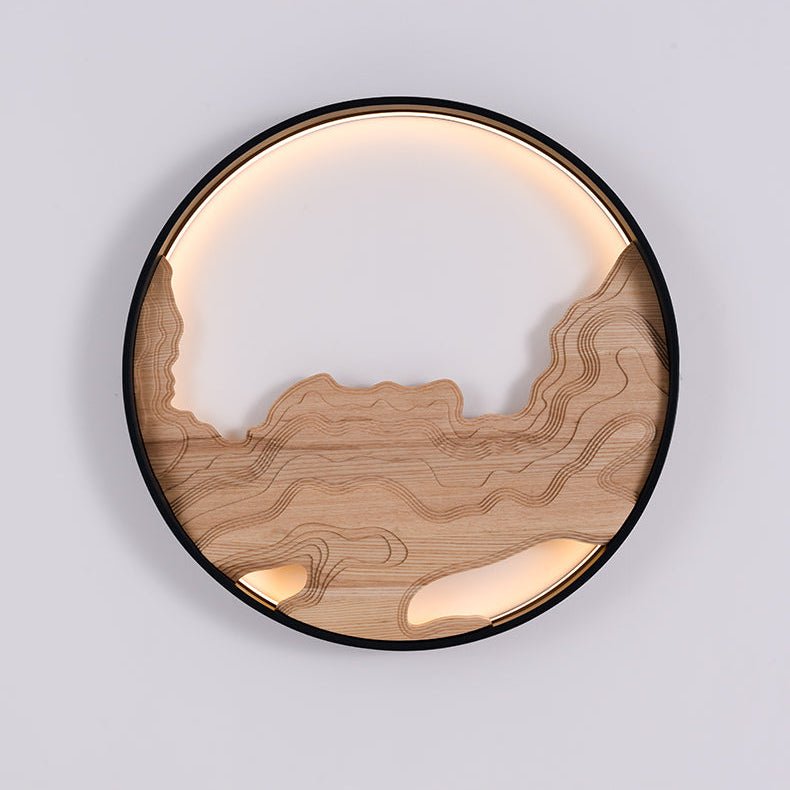 Carved light wood layers inside a black ring, lit along the top edge