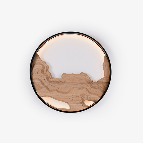 Flush mount wall sconce, a carved wood landscape inside a black ring
