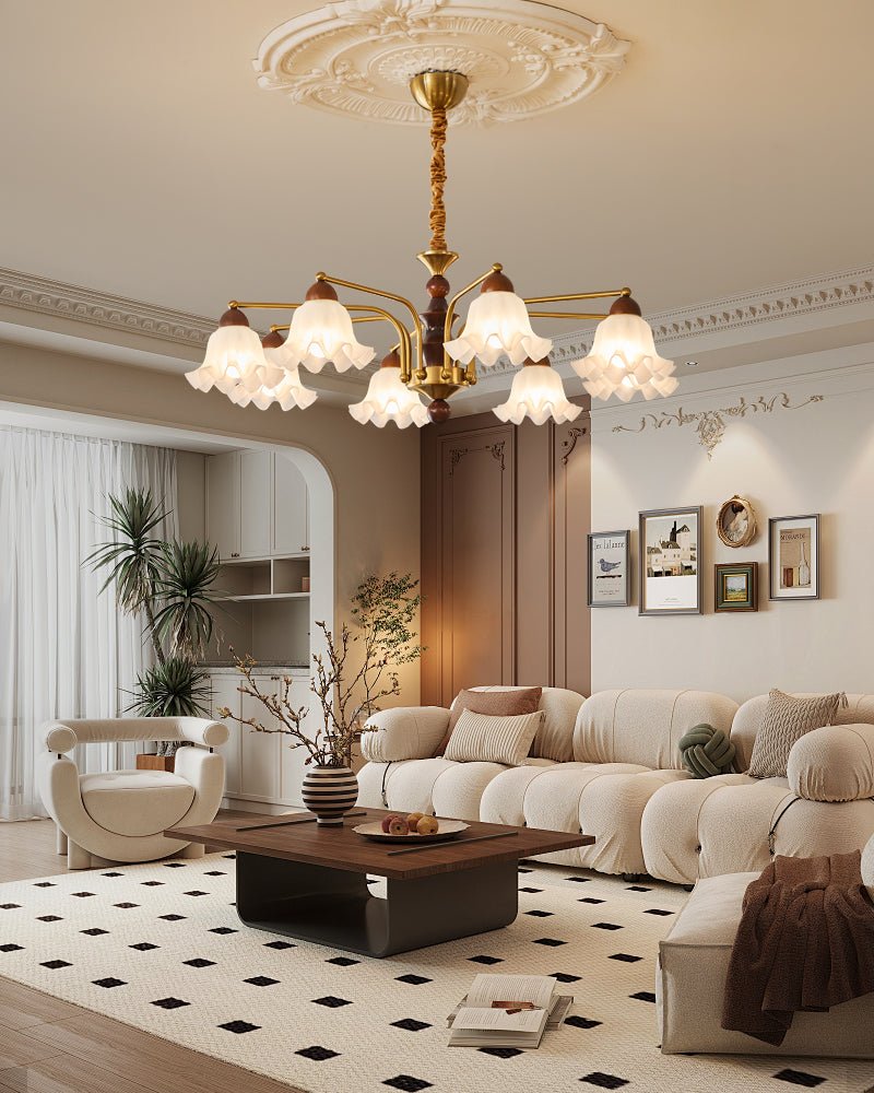 The fitting lit in a pale living room above a sofa and a plant
