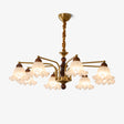 Fluted frosted glass bells on brass arms around a walnut column