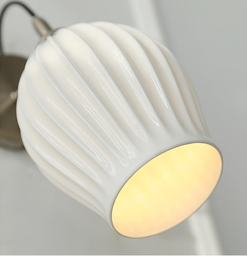 Close view of the fluted white shade and its open rim