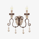 The two arm sconce at an angle showing how far the arms reach from the wall