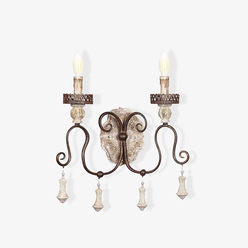 French wall sconce with two iron arms, carved candle cups and hanging drops