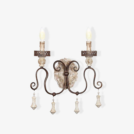 French wall sconce with two iron arms, carved candle cups and hanging drops