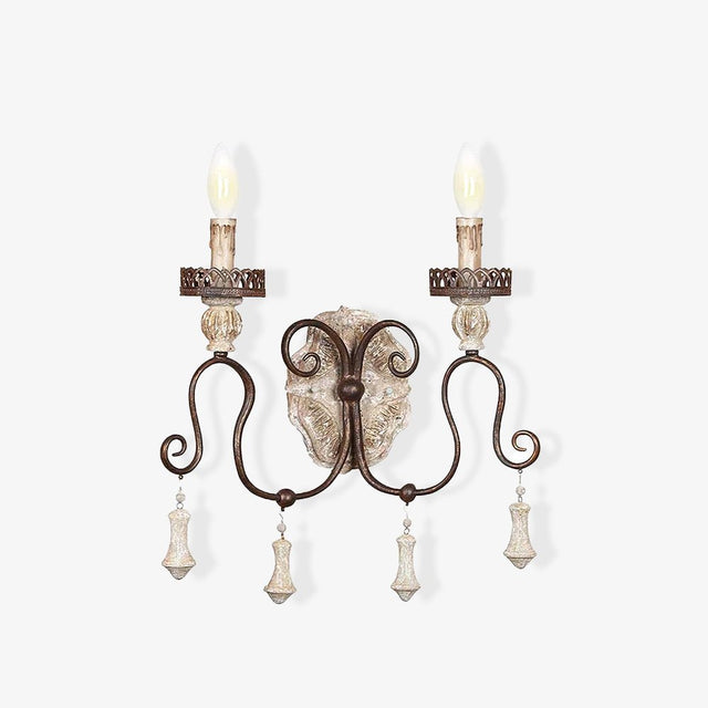 French wall sconce with two iron arms, carved candle cups and hanging drops
