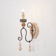 The single arm version with one carved candle cup and one hanging drop