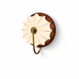 The walnut version at an angle, the brass hook curving under the shade