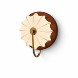 The walnut version seen from the front, the pleated rosette facing out